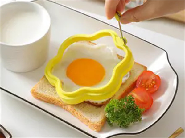 Will using silicone fried egg molds stick to the pan?