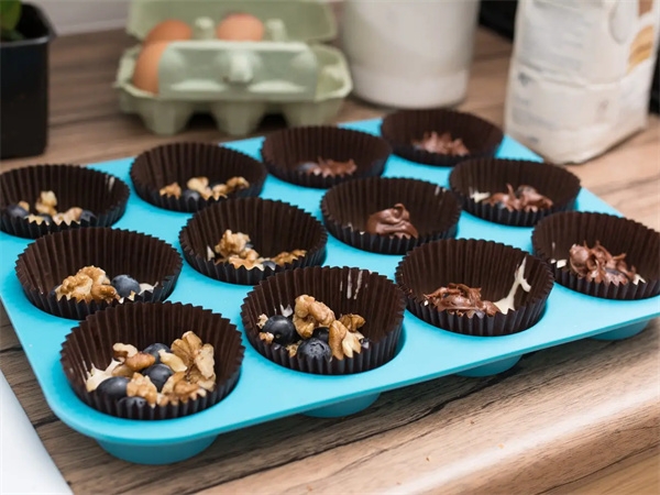 Can silicone cake molds be baked in an oven?
